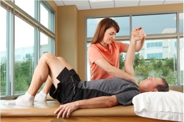 Physical therapist working with a patient injured in a car wreck