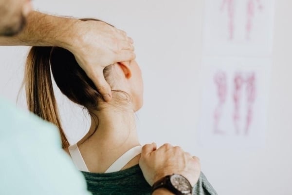 Woman receiving a chiropractic adjustment