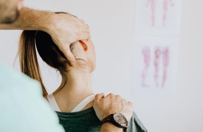 Chiropractor adjusting patient